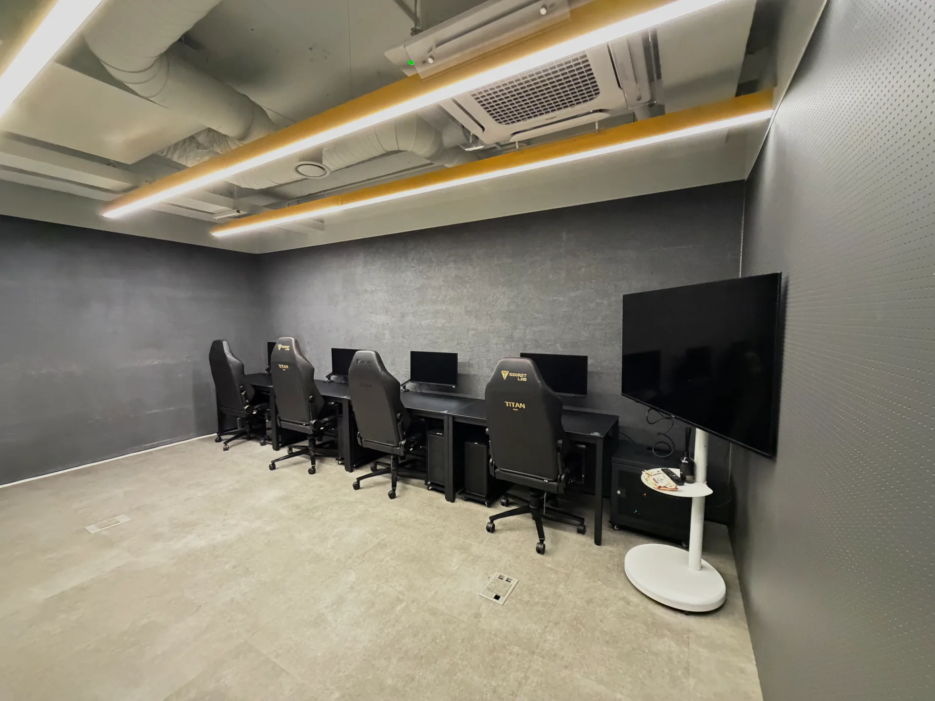 Additional 5F training space with gaming stations and a large review display